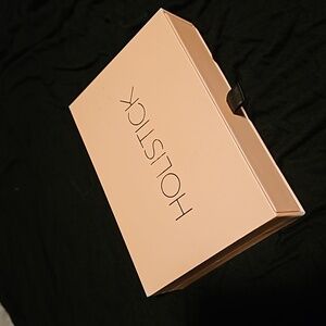 Holistick roller ball fragrances in beautiful gift box. Never used
